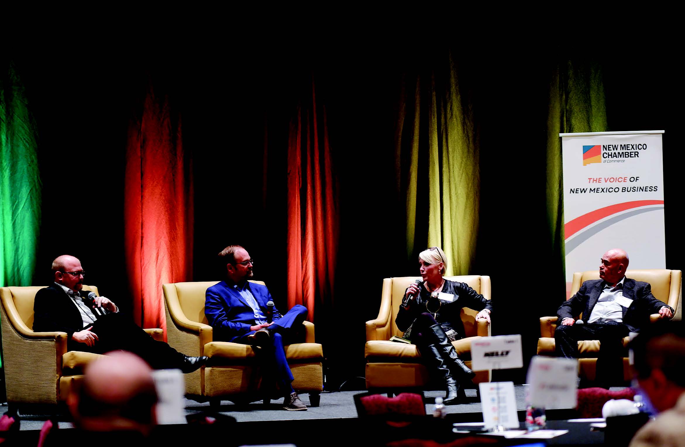 Charise Swanson, speaking at a New Mexico Chamber of commerce event, is the first woman in NMREC history to serve as its CEO.