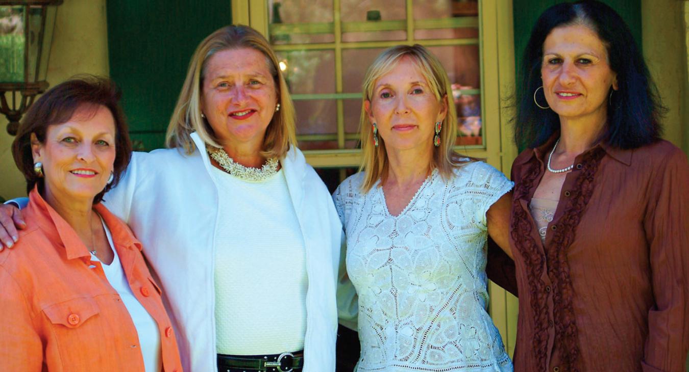 ABOVE: From left, Beverly Duran, Barbara Richardson, Patricia French and Alexis Girard were instrumental in starting the New Mexico Historic Marker Initiative. BACKGROUND: Workers complete installation of the roadside marker honoring Cathay Williams. PHOTOS COURTESY OF THE NEW MEXICO HISTORIC WOMEN MARKER INITIATIVE