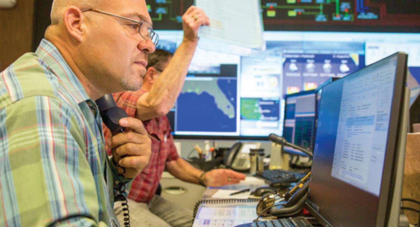 Employee working on outage reporting