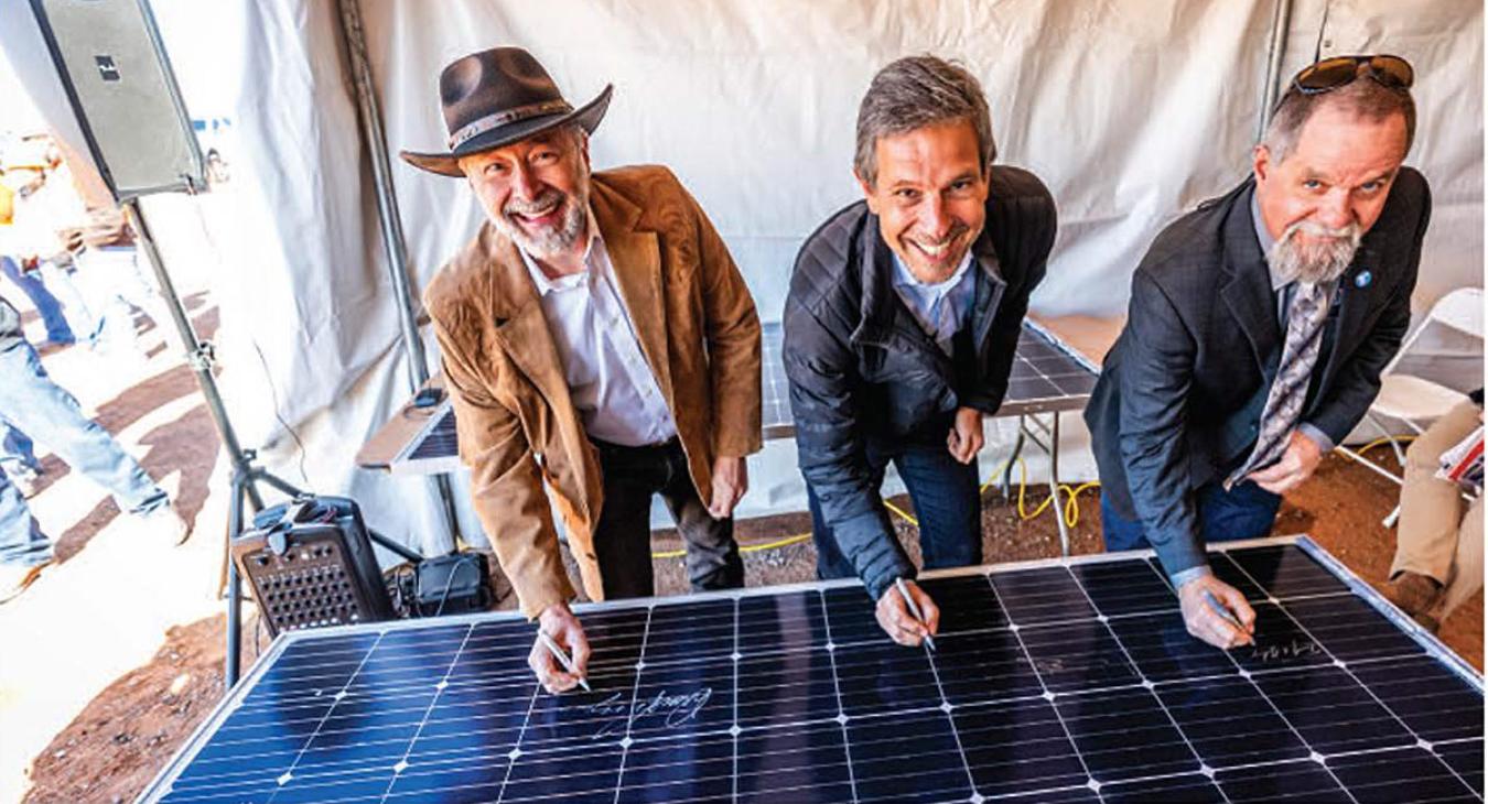 From left: Tri-State CEO Duane Highley, CEO and President of Origis Energy Guy Vanderhaegen and Board Chairman of Tri-State Tim Rabon sign a solar panel to commemorate the construction of Escalante Solar Project in Prewitt, New Mexico. 