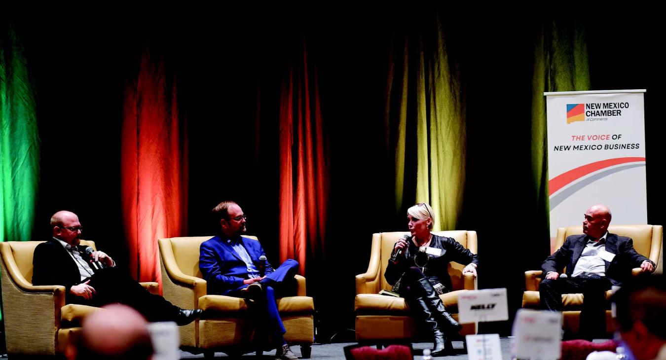 Charise Swanson, speaking at a New Mexico Chamber of commerce event, is the first woman in NMREC history to serve as its CEO.
