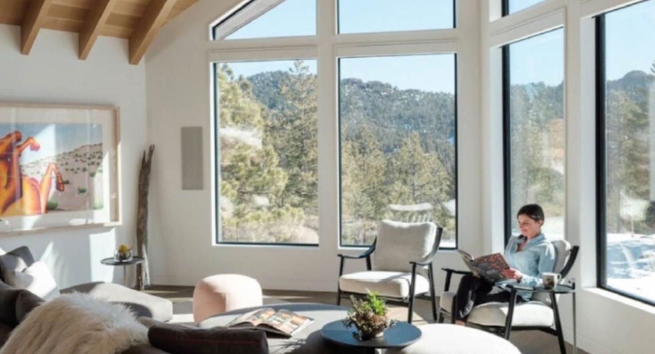 Woman reading in sunroom