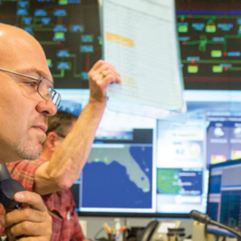 Employee working on outage reporting